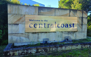The “Welcome to the Central Coast” sign before cleaning