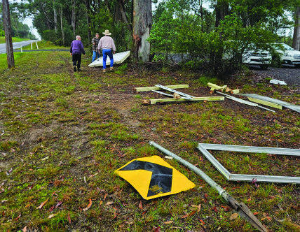 Debris and the traffic hazard chevron sign after the crash